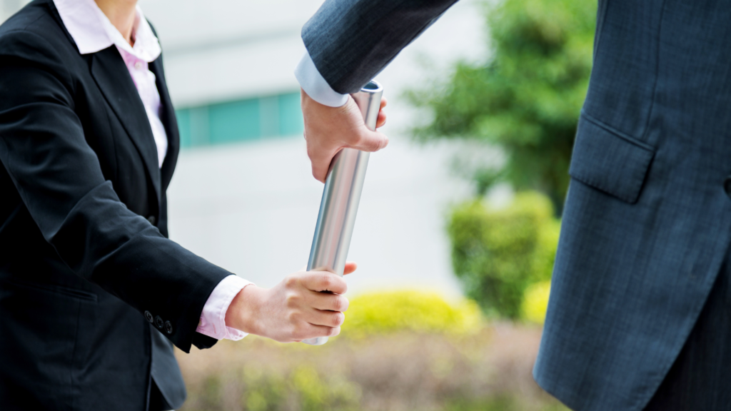Baton being passed between CEOs